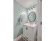 Charming bathroom with a white vanity, a large mirror, and updated fixtures at 8382 Camp Gregg Ln, North Charleston, SC 29418