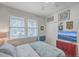 Spacious bedroom includes a double bed, large windows, and ample closet space at 8382 Camp Gregg Ln, North Charleston, SC 29418