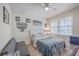 Cozy bedroom features a double bed, window seating, and decorative wall art at 8382 Camp Gregg Ln, North Charleston, SC 29418