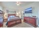Main bedroom with en-suite bathroom and large TV at 8382 Camp Gregg Ln, North Charleston, SC 29418