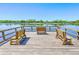 Three wooden benches on a community dock at 8382 Camp Gregg Ln, North Charleston, SC 29418