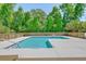 L-shaped community pool with wooden fence at 8382 Camp Gregg Ln, North Charleston, SC 29418