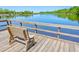Wooden bench overlooking the tranquil water from the dock at 8382 Camp Gregg Ln, North Charleston, SC 29418