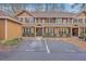 Tan two-story home with black shutters and parking at 8382 Camp Gregg Ln, North Charleston, SC 29418