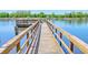 Wooden fishing dock extending over calm water at 8382 Camp Gregg Ln, North Charleston, SC 29418