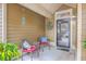 Cozy front porch with seating for two at 8382 Camp Gregg Ln, North Charleston, SC 29418