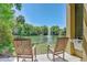 Relaxing lake view with fountain and comfortable rocking chairs at 8382 Camp Gregg Ln, North Charleston, SC 29418