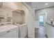 Convenient laundry room with washer, dryer, and ample shelving at 8382 Camp Gregg Ln, North Charleston, SC 29418