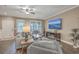 Open concept living room with hardwood floors and a modern fireplace at 8382 Camp Gregg Ln, North Charleston, SC 29418
