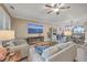Spacious living room features comfortable seating, a large TV, and a cozy fireplace at 8382 Camp Gregg Ln, North Charleston, SC 29418