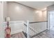 Elegant staircase with white railings and dark hardwood floors at 8382 Camp Gregg Ln, North Charleston, SC 29418