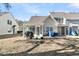 Sunny backyard with patio, grill, and sunroom access at 8646 Grassy Oak Trl, North Charleston, SC 29420