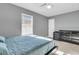 Bright bedroom with a bed, dresser, and gray walls at 8646 Grassy Oak Trl, North Charleston, SC 29420