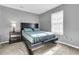 Simple bedroom with a double bed and gray walls at 8646 Grassy Oak Trl, North Charleston, SC 29420