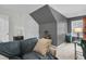 Bonus room with a sofa and gray walls at 8646 Grassy Oak Trl, North Charleston, SC 29420