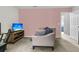 Bonus room with a sofa and a large TV at 8646 Grassy Oak Trl, North Charleston, SC 29420