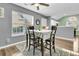 Cozy dining area with hardwood floors and a view into the kitchen at 8646 Grassy Oak Trl, North Charleston, SC 29420