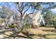 Attractive two-story townhome with green siding, brick accents, and mature landscaping at 8646 Grassy Oak Trl, North Charleston, SC 29420