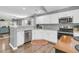 Modern kitchen with white cabinets, granite countertops, and stainless steel appliances at 8646 Grassy Oak Trl, North Charleston, SC 29420