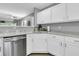 Modern kitchen with white cabinets, granite countertops, and stainless steel appliances at 8646 Grassy Oak Trl, North Charleston, SC 29420