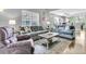 Cozy living room with comfortable sofas, coffee table, and hardwood floors at 8646 Grassy Oak Trl, North Charleston, SC 29420