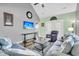 Open living space with vaulted ceiling, comfortable seating, and access to patio at 8646 Grassy Oak Trl, North Charleston, SC 29420