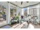 Sunroom with rocking chair and access to backyard at 8646 Grassy Oak Trl, North Charleston, SC 29420