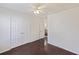Bright bedroom featuring double doors and dark hardwood floors at 9609 Crosscut Dr, Ladson, SC 29456