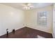Simple bedroom with dark hardwood floors and a window with blinds at 9609 Crosscut Dr, Ladson, SC 29456