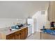 Small kitchen with white appliances and wood cabinets at 9609 Crosscut Dr, Ladson, SC 29456