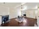 Living room with hardwood floors, fireplace and ceiling fan at 9609 Crosscut Dr, Ladson, SC 29456