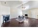 Living room with fireplace, dark hardwood floors, and a ceiling fan at 9609 Crosscut Dr, Ladson, SC 29456