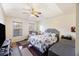 Spacious main bedroom with wood floors and large windows at 9609 Crosscut Dr, Ladson, SC 29456