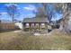 Wooden shed with double doors, providing ample storage space at 9609 Crosscut Dr, Ladson, SC 29456