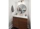 Modern bathroom with a sleek vanity and round mirror at 1123 Oak Overhang St, Charleston, SC 29492