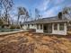 House with a large sunroom and an inground pool at 119 Sumners Aly, Summerville, SC 29485