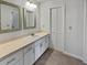 Bathroom with double vanity, updated lighting, and linen closet at 119 Sumners Aly, Summerville, SC 29485