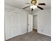 Bright bedroom with ceiling fan, neutral walls, and ample closet space at 119 Sumners Aly, Summerville, SC 29485
