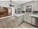 Modern kitchen features white cabinets, quartz countertops, and stainless steel appliances at 119 Sumners Aly, Summerville, SC 29485