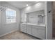 Double vanity bathroom with large mirror and tile flooring at 137 Claret Cup Way, Charleston, SC 29414