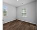 Bright bedroom with hardwood floors and two windows at 137 Claret Cup Way, Charleston, SC 29414