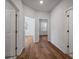 Hallway with wood floors and access to bedrooms at 137 Claret Cup Way, Charleston, SC 29414