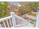 Stairs leading to a fenced backyard with lush greenery at 1442 Eutaw Battalion Dr, Charleston, SC 29412