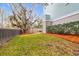 Spacious backyard with grassy lawn and large oak tree at 1442 Eutaw Battalion Dr, Charleston, SC 29412