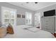 Comfortable bedroom with dresser, TV, and white bedding at 1442 Eutaw Battalion Dr, Charleston, SC 29412