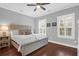 Relaxing bedroom with light-grey bed frame and ceiling fan at 1442 Eutaw Battalion Dr, Charleston, SC 29412