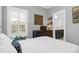 Spacious bedroom with a dark wooden dresser and white bedding at 1442 Eutaw Battalion Dr, Charleston, SC 29412