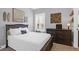 Serene bedroom with a dark wooden bed frame and a dresser at 1442 Eutaw Battalion Dr, Charleston, SC 29412