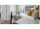 Bright bedroom with a wooden bed frame and white bedding at 1442 Eutaw Battalion Dr, Charleston, SC 29412