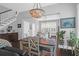 Charming dining room features a rustic table, chandelier, and hardwood floors at 1442 Eutaw Battalion Dr, Charleston, SC 29412